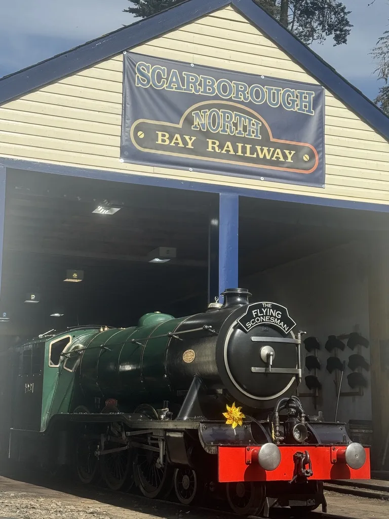 Scarborough North Bay Railway locomotive at engine shed with railway sign
