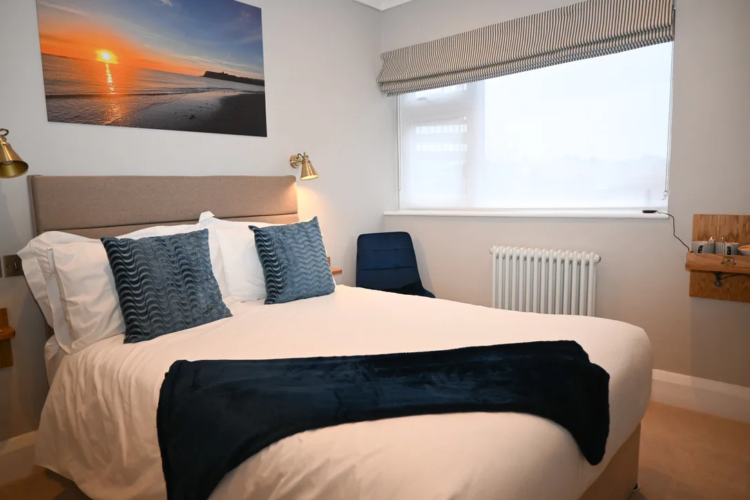 Small Double Room 1 – Seaside Hideaway Hotel Scarborough Small Double Room 1 at Seaside Hideaway Hotel in Scarborough, with double bed and window seating area