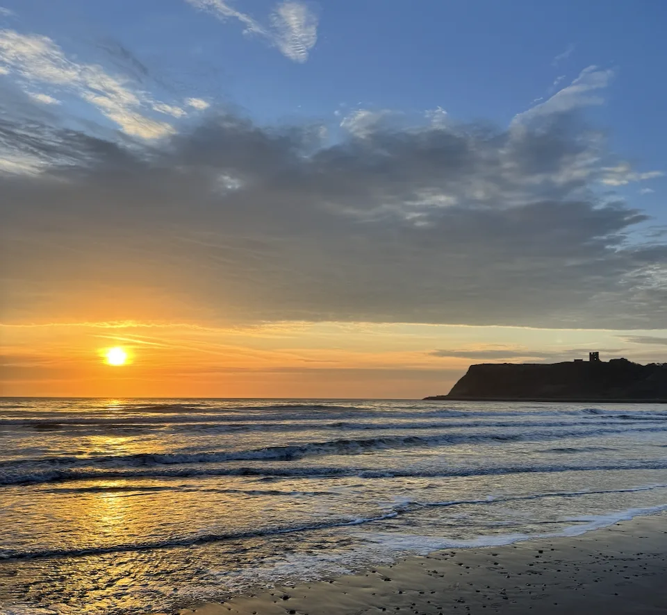 Autumn sunrise over Scarborough North Bay with Scarborough Castle